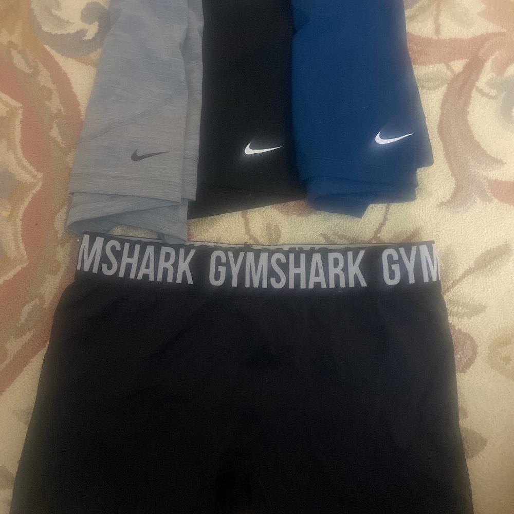 Blue, black and gray Nike Pro shorts and GymShark size M